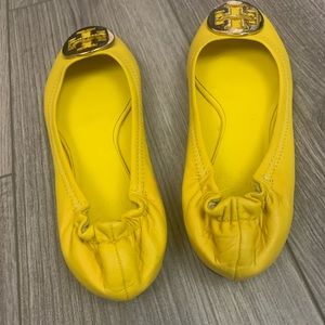Tory Burch size 7 yellow flats. Slight scuffing on the right toe, see pictures.
